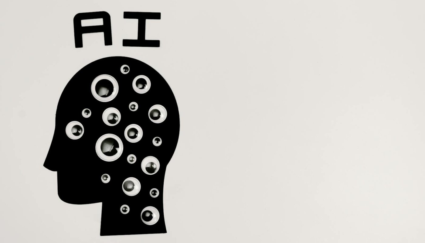 Abstract illustration of AI with silhouette head full of eyes, symbolizing observation and technology.