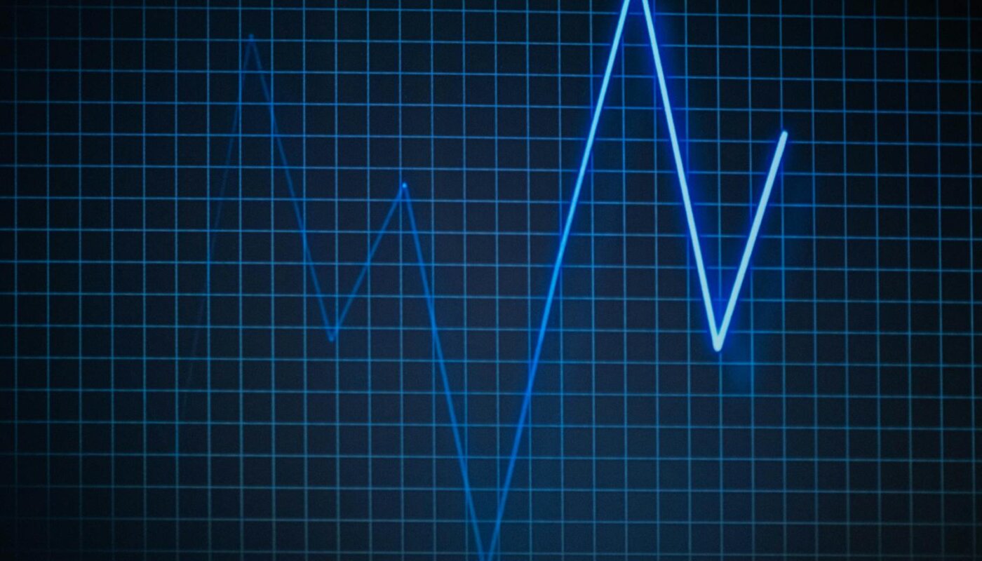 ECG graph on a grid background symbolizing heartbeat and medical data.